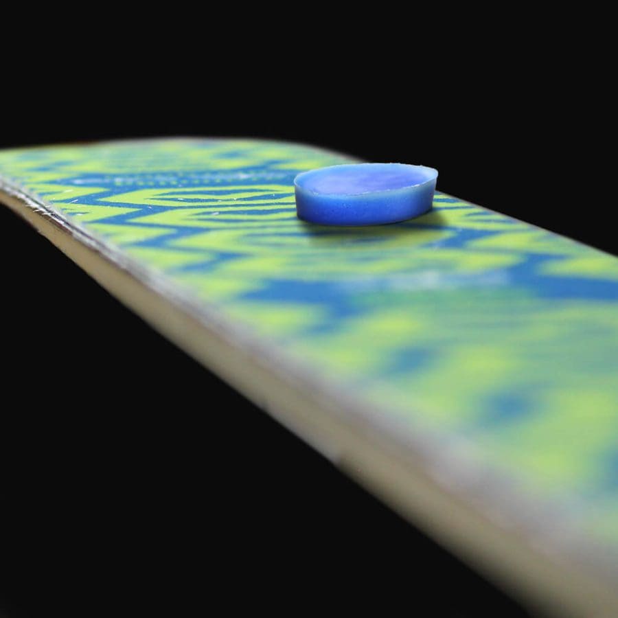 Climbing skin wax sits of top of ski skin plush